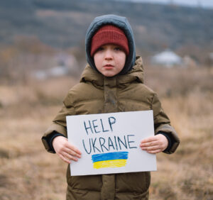 War of Russia against Ukraine. Crying boy asks to stop the war in Ukraine.